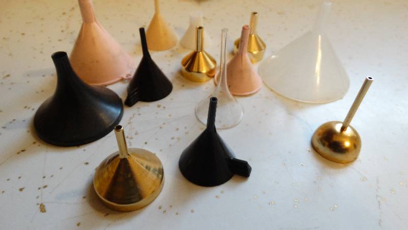 lot 974 image: Lot of perfume funnels.