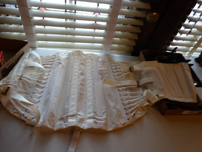 lot 1289 image: Vintage girdle lace up still has original wearing washing case instruction in wonderful shape.