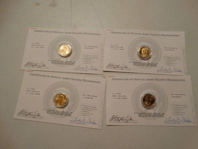 lot 1335 image: 4 - never circulated 2007 presidential Washington gold dollars.