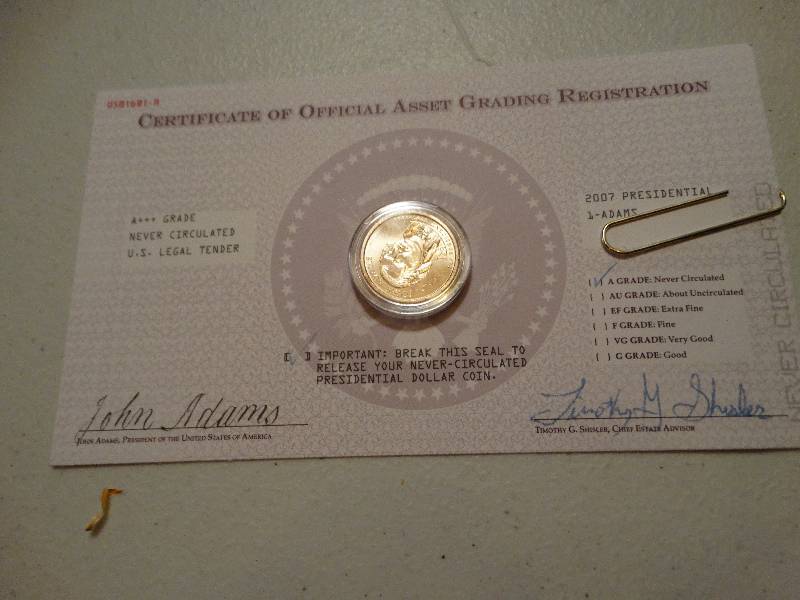 lot 1337 image: 1 - 2007 Adams gold dollar never circulated.