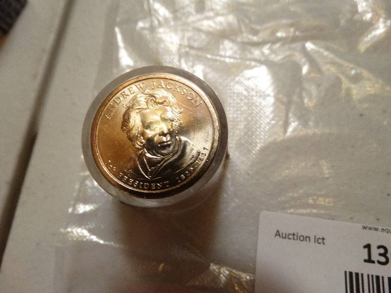lot 1369 image: 12- Andrew Jackson gold dollars in case never circulated.
