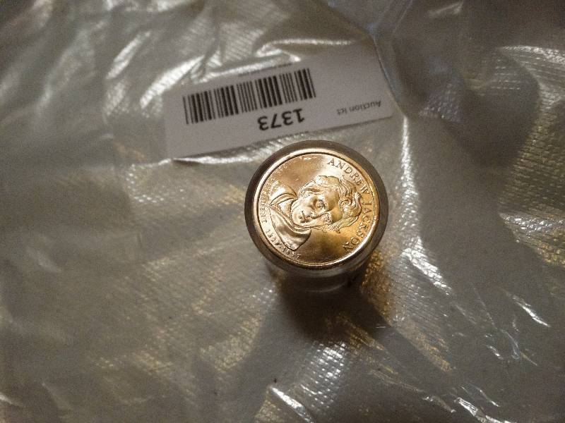lot 1373 image: 12- Andrew Jackson gold dollars in case never circulated.