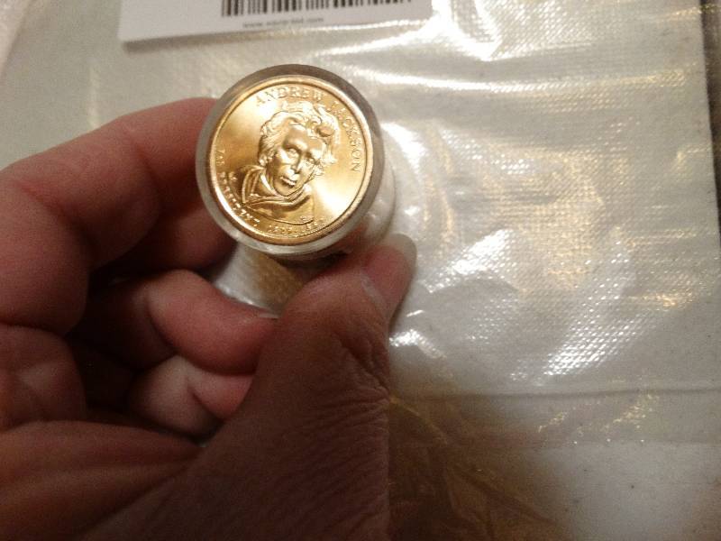 lot 1375 image: 12- Andrew Jackson gold dollars in case never circulated.