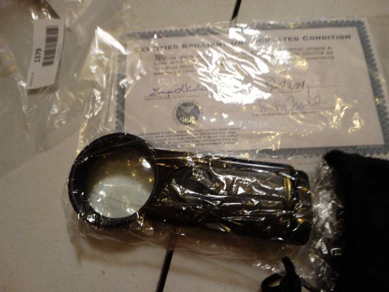 lot 1379 image: Magnifier glass & gloves.