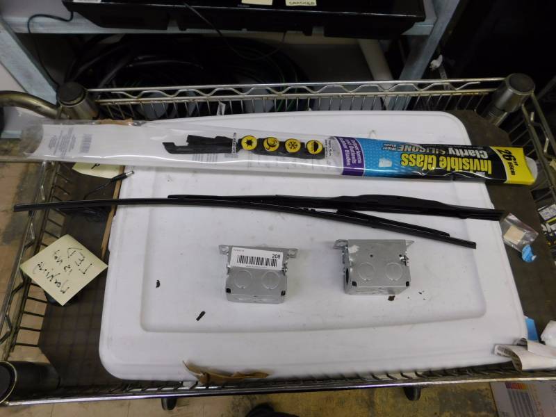 lot 208 image: wiper blades and electrical boxes