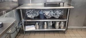 lot 18734 image: 59in Stainless Steel Table W 2 Under Storage