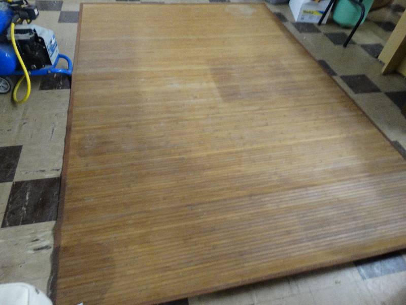 lot 360 image: Bamboo arena rug.