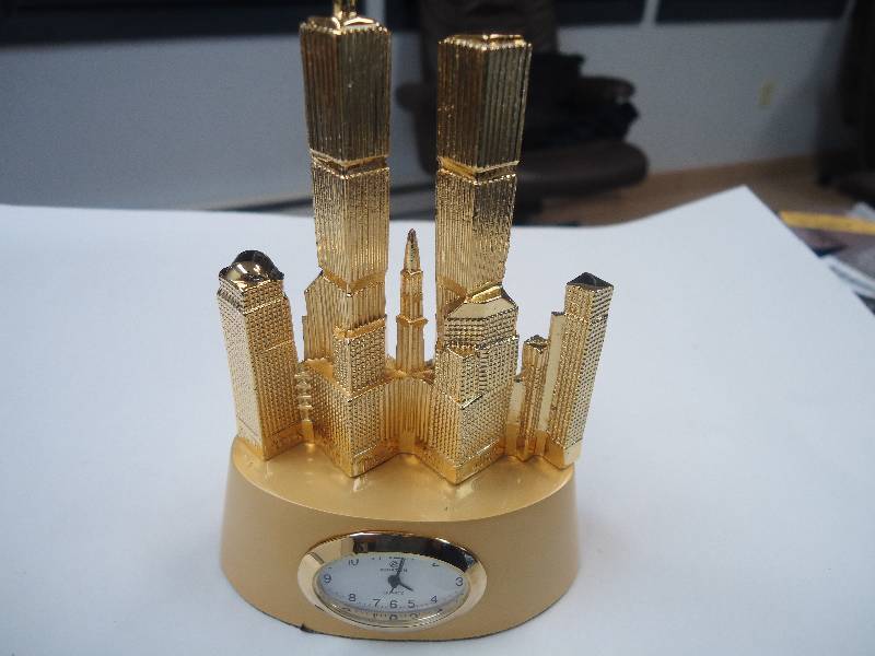 lot 5547 image: Ewatch Twin towers figure with time piece.