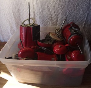 lot 48 image: Tote of parts for old candy dispensers