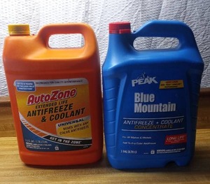 lot 168 image: AutoZone extended life antifreeze and coolant unopened & Peak Blue Mountain antifreeze and coolant concentrate unopened