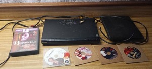 lot 182 image: DVD player with DVDs and a TV antenna