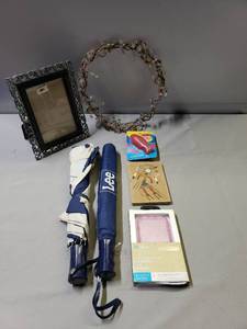 lot 141 image: Crystal Beaded Wreath, Picture Frame, Lee Brand Umbrellas, iPhone Phone Case, IN PACKAGE Swedish Fish Soap, Navajo Art