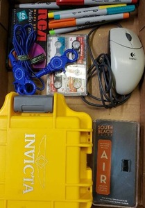 lot 147 image: Sharpies, Invicta Watch Box, South Beach Smoke Charger, Mouse, Cassette Tapes