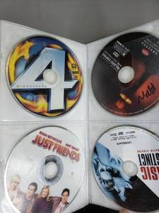 lot 52 image: Approx 50 DVDs & Organizer