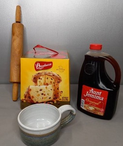 lot 22 image: NIP 12 Gal. Aunt Jemima Syrup, Panettiere Bread Kit, Signed Ceramic Soup Cup & Rolling Pin
