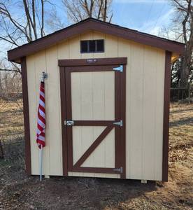 lot 1000 image: Sturdi-Bilt 8ft x 10ft Elite Gable Shed includes Flag - Only 1 Year Old - THIS ITEM HAS THE OPTION FOR A DIFFERENT REMOVAL DAY...PLEASE CALL 316-655-0218 with any questions
