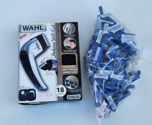 lot 4045 image: Wahl Deluxe Self Cut Haircutting Set Model 79231 and Razors