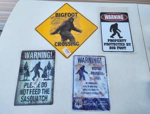 lot 4047 image: (4) New Big Foot Metal Signs