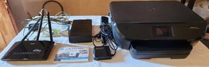 lot 6046 image: HP ENVY Printer 5540, D-Link Model DIR619L, Seagate DVR Expander and Accessories