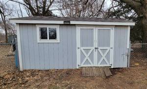 lot 1023 image: 10ft x 16ft Sturdi-Bilt Elite Cape Cod Storage Shed - Front and Rear Doors - Contents Not Included - THIS ITEM HAS THE OPTION FOR A DIFFERENT REMOVAL DAY...PLEASE CALL 316-655-0218 with any question