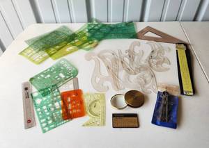 lot 4142 image: Teledyne Post, Slide Ruler, Templates and Brass Magnifying Glass