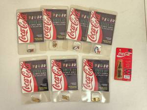 lot 4160 image: Vintage Coca Cola Olympic Game Pins and Korean Olympic Miniature Contour Bottle