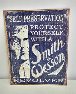 lot 4166 image: Metal Smith & Wesson Sign