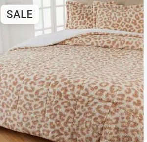lot 22646 image: Warm & Cozy Sherpa Comforter. USED. COLOR MAY DIFFER FROM STOCK PHOTO, EXACT SIZE UNKNOWN. HAS DOG HAIR