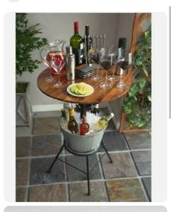 lot 22766 image: Round Outdoor Bar Table with Ice Bucket, table color differs from stock photo, bucket dented, possibly missing hardware, not fully inspected