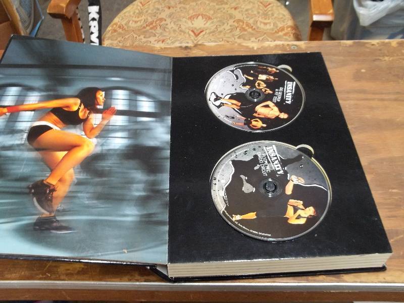 lot 2114 image: INSANITY workout dvd collection