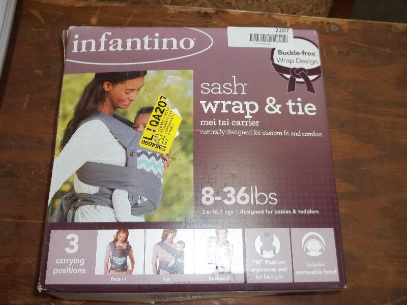 lot 2207 image: Infantino Sash Mei Tai 3 Position Baby Carrier