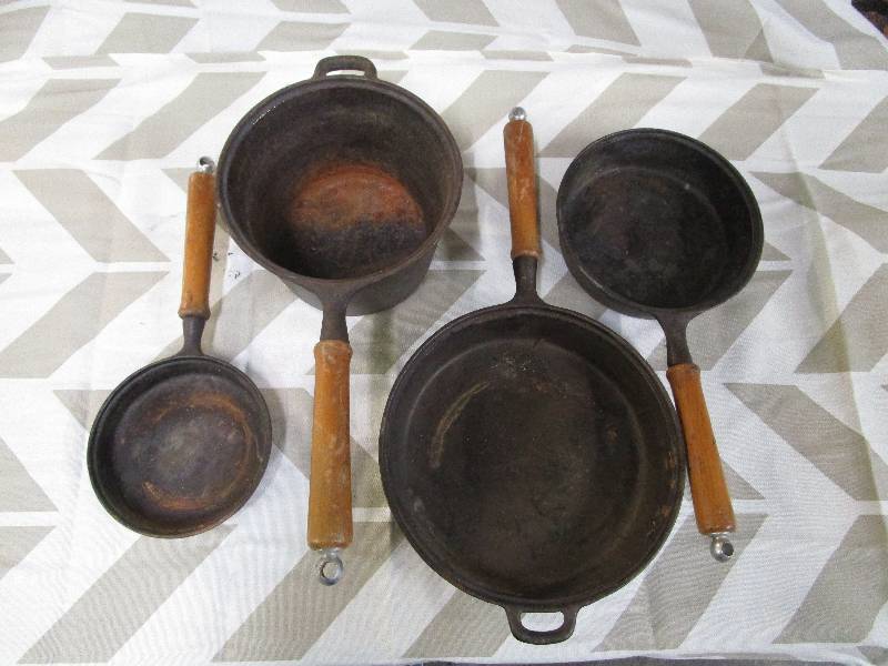 lot 2243 image: cast iron skillets with wooden handles