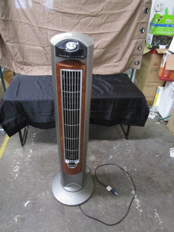 lot 2262 image: Lasko Oscillating Tower Fan With Adjustable Twin Grills and Remote Control