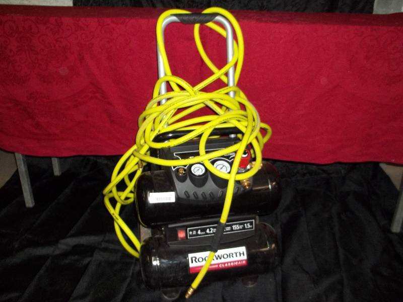 lot 2224 image: Rockworth 1.5HP 4 Gallon Portable Electric Twin-Stack Air Compressor