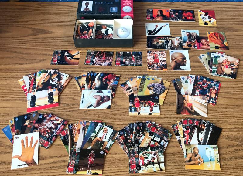 lot 3309 image: Michael Jordan - Huge MJ Basketball Card Collection with Golf Ball - Tribute Set