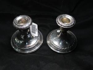 lot 27449 image: Pair of Cement Filled Sterling Candle Holders