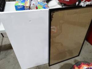 lot 27535 image: canvas with small hole and picture frame