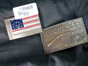 lot 27721 image: Winchester Repeating Arms & 76 Stamp Belt Buckles