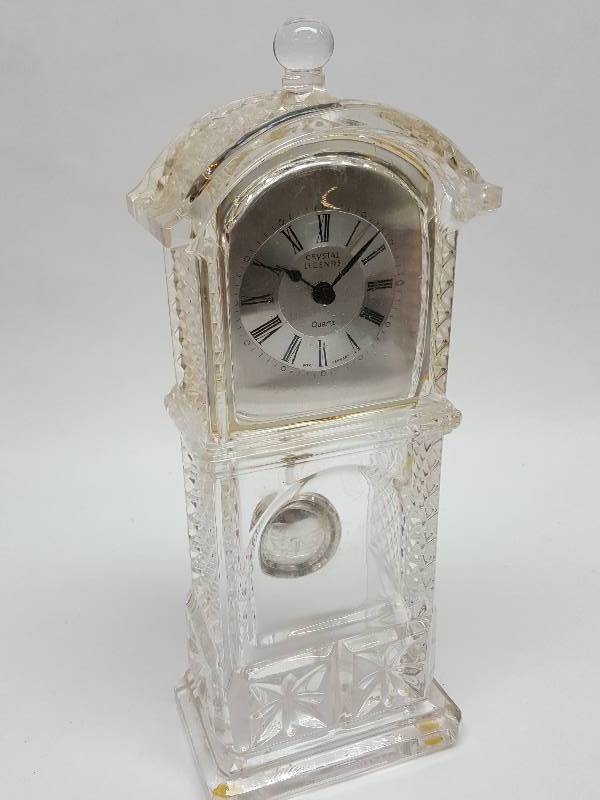 lot 7647 image: Real Crystal Legends Grandfather Clock that most likely needs a battery.  Dimensions 10 x 4 x 2.5