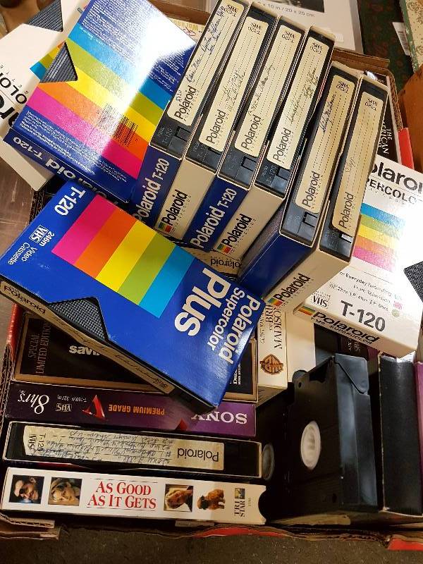 lot 7648 image: Over 40 old VHS tapes with a wild assortment of titles.  If you still have a player