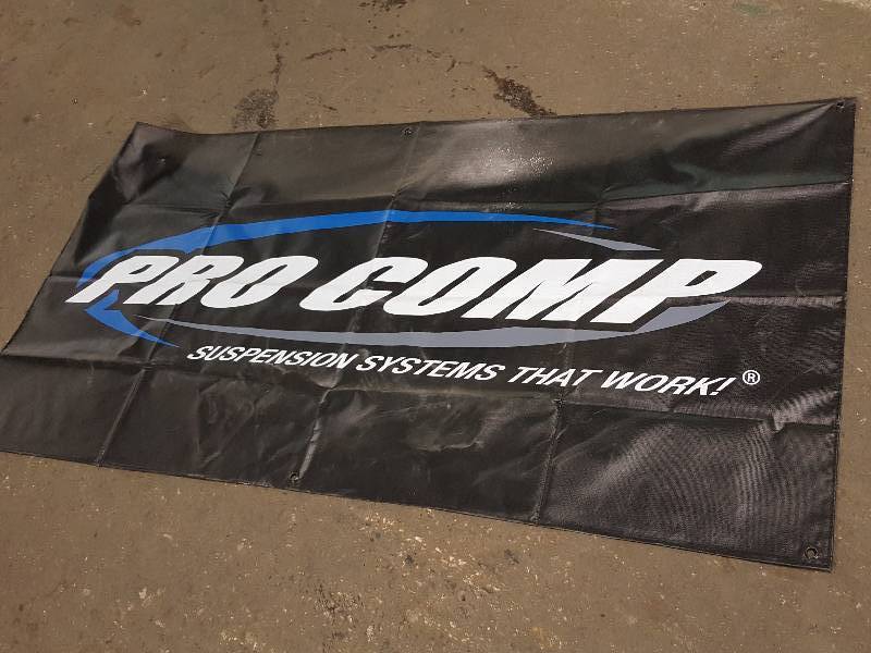 lot 7655 image: Hang this 30 X 60 vinyl Pro Comp tires banner