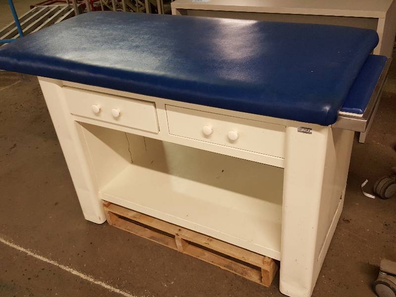 lot 7658 image: Metal cabinet with the padded top on this doctors examination table.