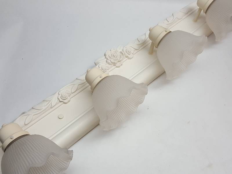 lot 7605 image: Wife changed the decor and now going to the high bid is this bathroom 4 bulb light fixture.