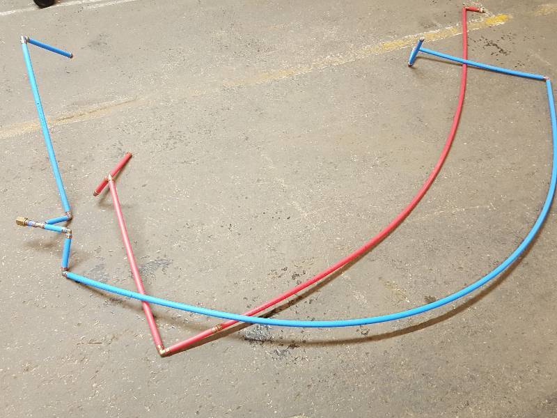 lot 7606 image: New Power Pex hot and cold water lines with finished fittings.