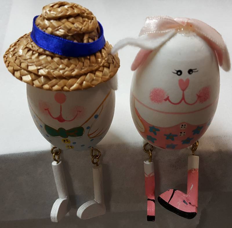 lot 7610 image: Cute pair of Mr and Mrs Easter eggs made to sit on a table or mantle with their legs hanging over.