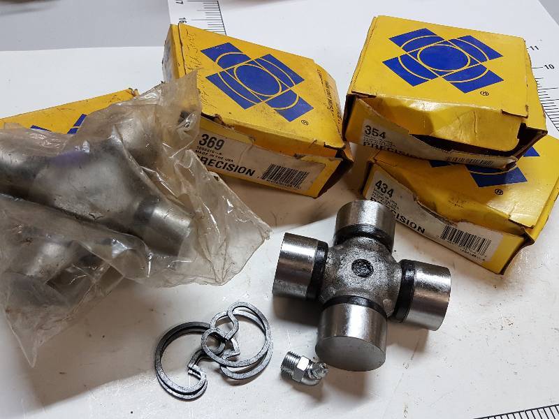 lot 7615 image: Box of new automotive U-Joints and the big one is the real money maker if you know what it fits