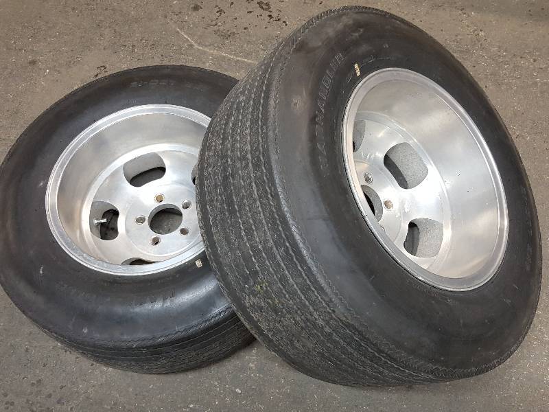 lot 7616 image: Very nice pair of 15 X 10 deep reversed aluminum Dish wheels and L-60 15 tires.