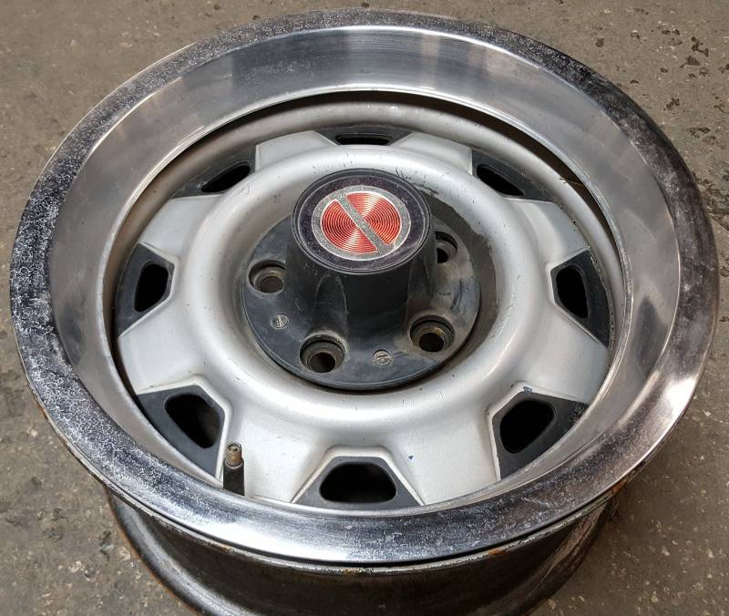 lot 7570 image: Factory Ford late 80s Ranger pickup rally 14 wheel with center cap and stainless trim ring