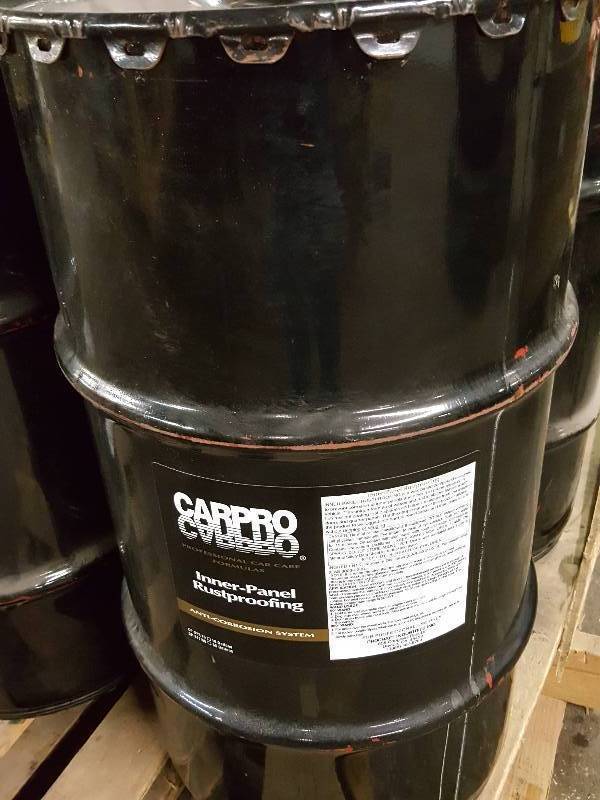 lot 8180 image: Sealed 16 gallon drum of CARPRO Inner-Panel Rustproofing for anti-corosion system.