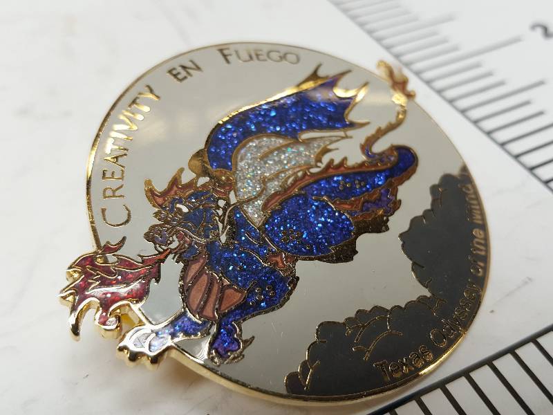lot 8747 image: Another one of those collectable hat or lapel pins most are finished with wild porcelain colors.